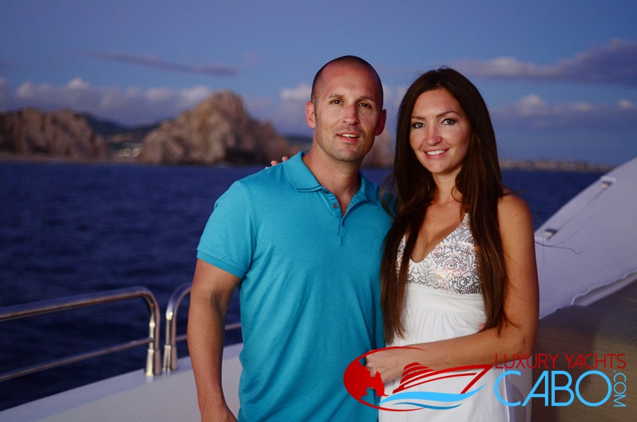 Luxury Yachts Cabo, Cabo San Lucas Yacht Charters, Los Cabos Luxury Yachts, Luxury Boats Cabo, Photography, Yachts, Boats, Charters, Boat Rentals Cabo, La Paz, mega Yachts, Yacht Charters Cabo San Lucas, beautiful couple on yacht in front of cabo Arch